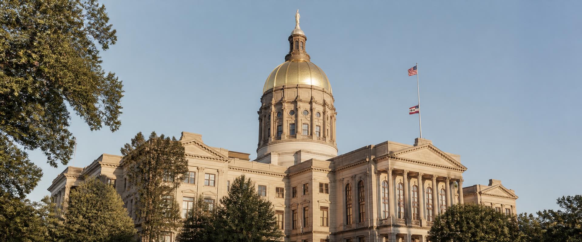 The Georgia State Capitol in Atlanta, its gold-leaf dome lit by late afternoon sun
